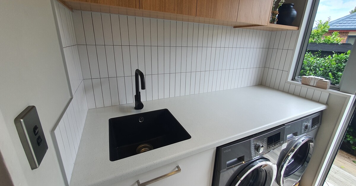 What do you put under tile to make it stick?